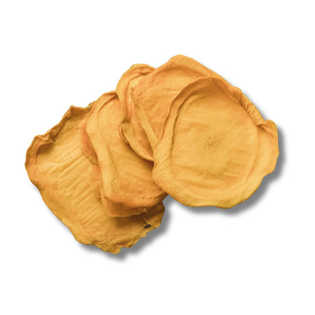 Loose slices of Green Australian dried mango showing pale colour and natural firmness.