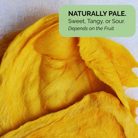 Australian dried green mango with a text overlay that reads "Naturally Pale. Sweet, Tangy, or Sour. Depends on the Fruit." highlighting natural flavour variation.