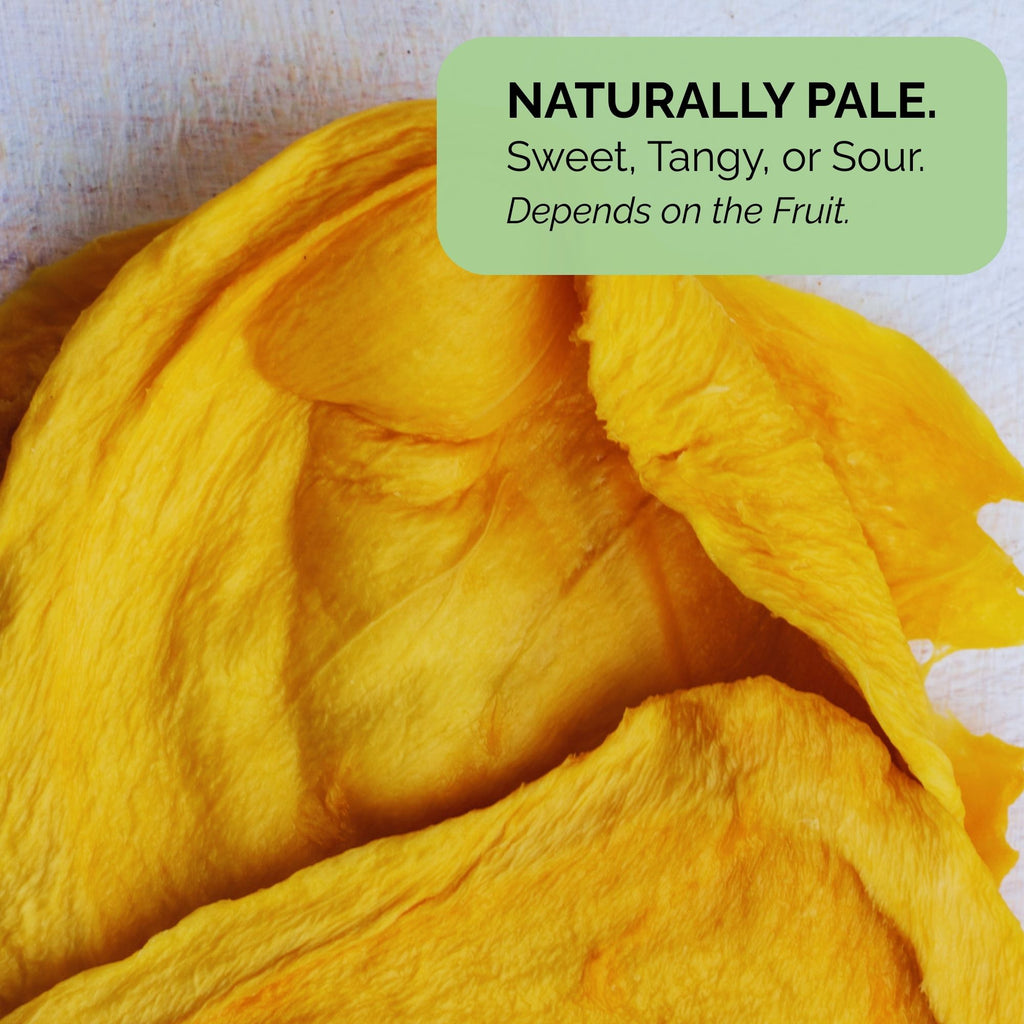 Australian dried green mango with a text overlay that reads "Naturally Pale. Sweet, Tangy, or Sour. Depends on the Fruit." highlighting natural flavour variation.