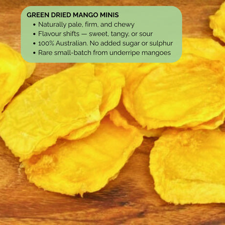 Green Dried Mango Minis on wooden surface with overlay text describing product highlights: pale, firm, chewy texture and varying flavour.