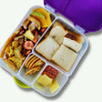 Kids lunchbox with dried fruit mix snack including mango, banana, strawberry and apple pieces