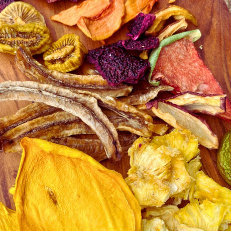 Top view of mixed dried fruit variety including mango banana pineapple strawberry and exotic fruits