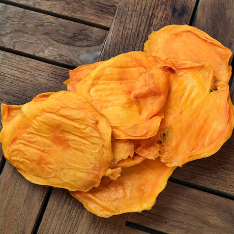 Close-up of soft chewy dried mango showing thick natural fruit texture.