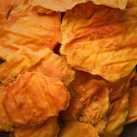 Close-up of Standard Australian dried mango highlighting natural texture and surface variation.