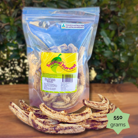 550g Tropical Harvest whole dried banana pack displayed with dried bananas. Soft, chewy, naturally sweet.