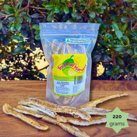 220g Tropical Harvest dried banana long resealable pouch with natural dried slices displayed. Perfect for lunchboxes or snacking.