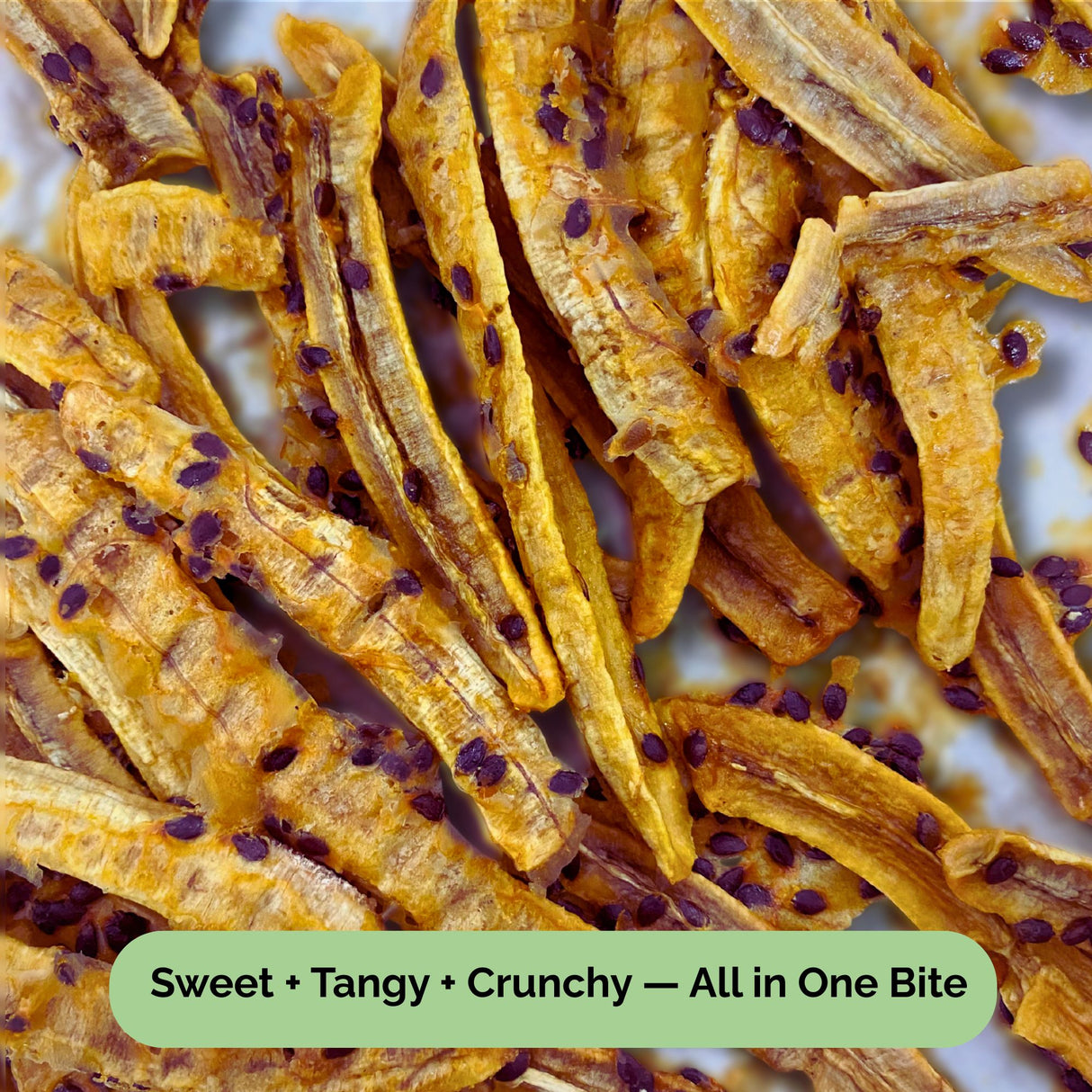 Close-up of Tropical Harvest dried banana strips drizzled with real passionfruit pulp and seeds. Sweet, tangy, and crunchy texture — 100% Australian-grown fruit.