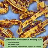 Dried banana strips with passionfruit pulp and seeds on a baking sheet. Text overlay: “Just Banana & Passionfruit. Nothing Else.” No sugar, no sulphites, no preservatives.