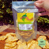 150g resealable pouch of Tropical Harvest dried pineapple flowers with a starburst label. Perfect for snacking, gifting, or decorating cakes.