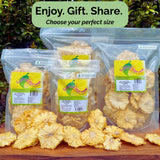 Range of Tropical Harvest dried pineapple flower packs displayed outdoors with text overlay: "Enjoy. Gift. Share. Choose your perfect size."