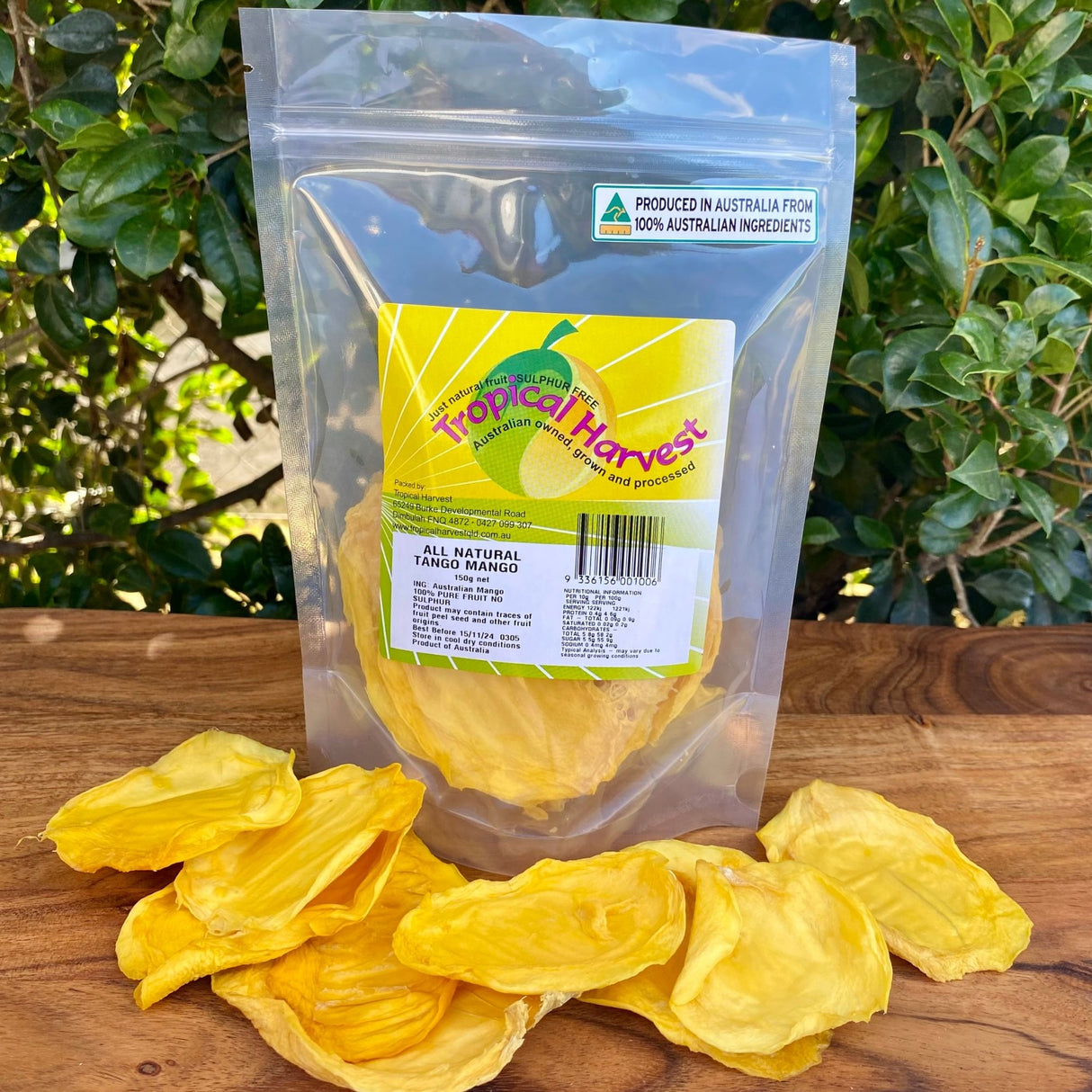 150g pack of Tropical Harvest Australian dried green mango with visible large slices and chewy texture, showing the pale colour unique to underripe mango.