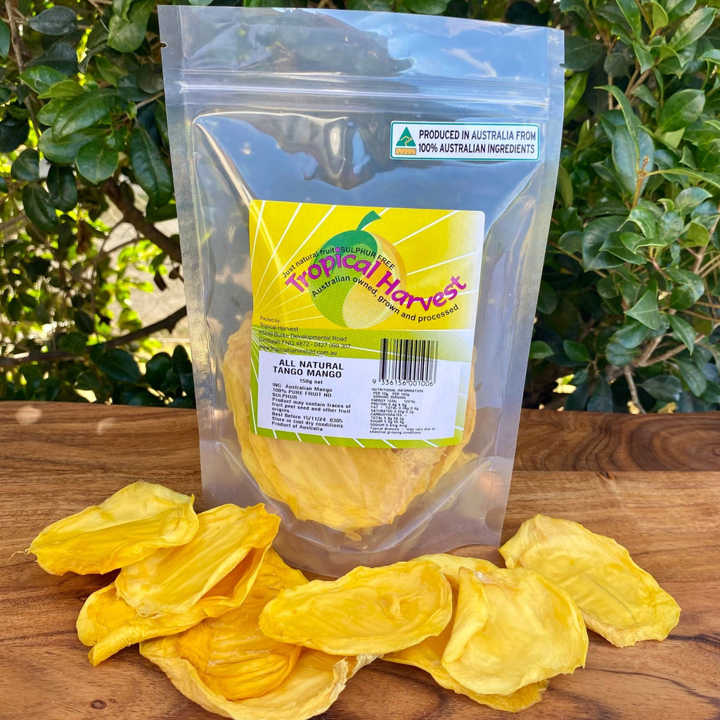 150g pack of Tropical Harvest Australian dried green mango with visible large slices and chewy texture, showing the pale colour unique to underripe mango.