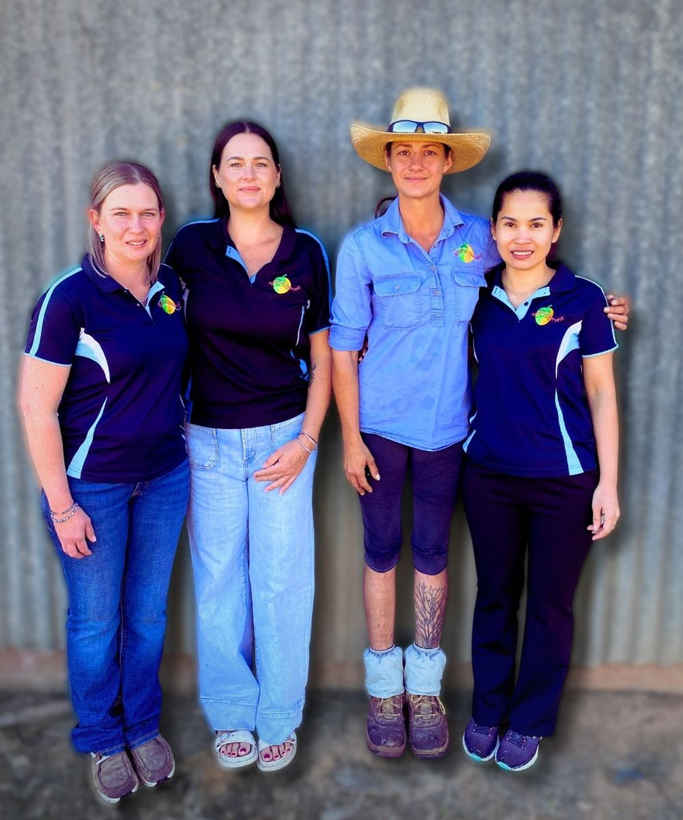 Four women from the Tropical Harvest team who help slice, dry, pack, and deliver Australian dried fruit with care.